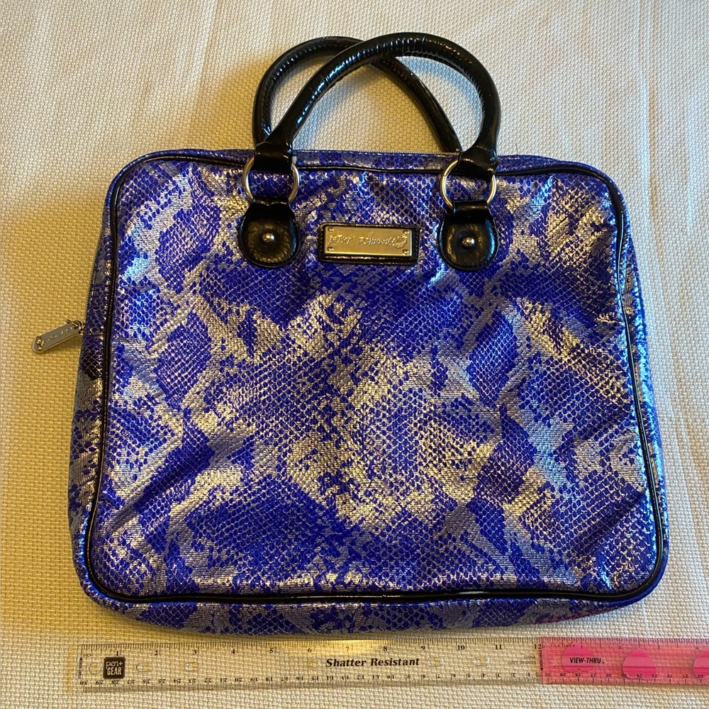 Betsy Johnson, cobalt blue snake print tech laptop sleeve bag with handles.